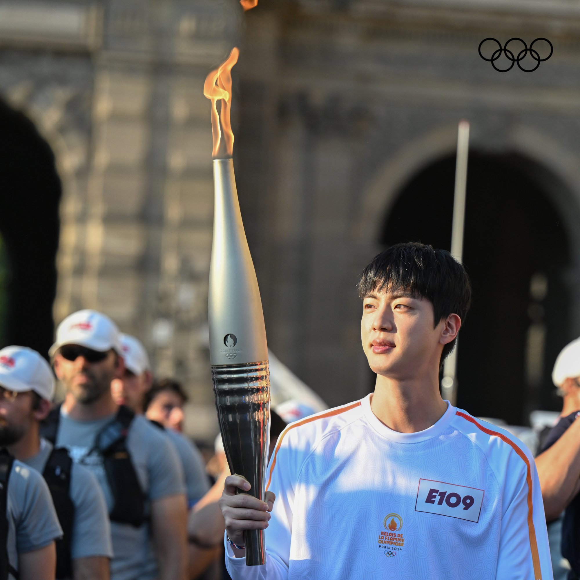 BTS' Jin carries the torch at the Olympic Torch Relay