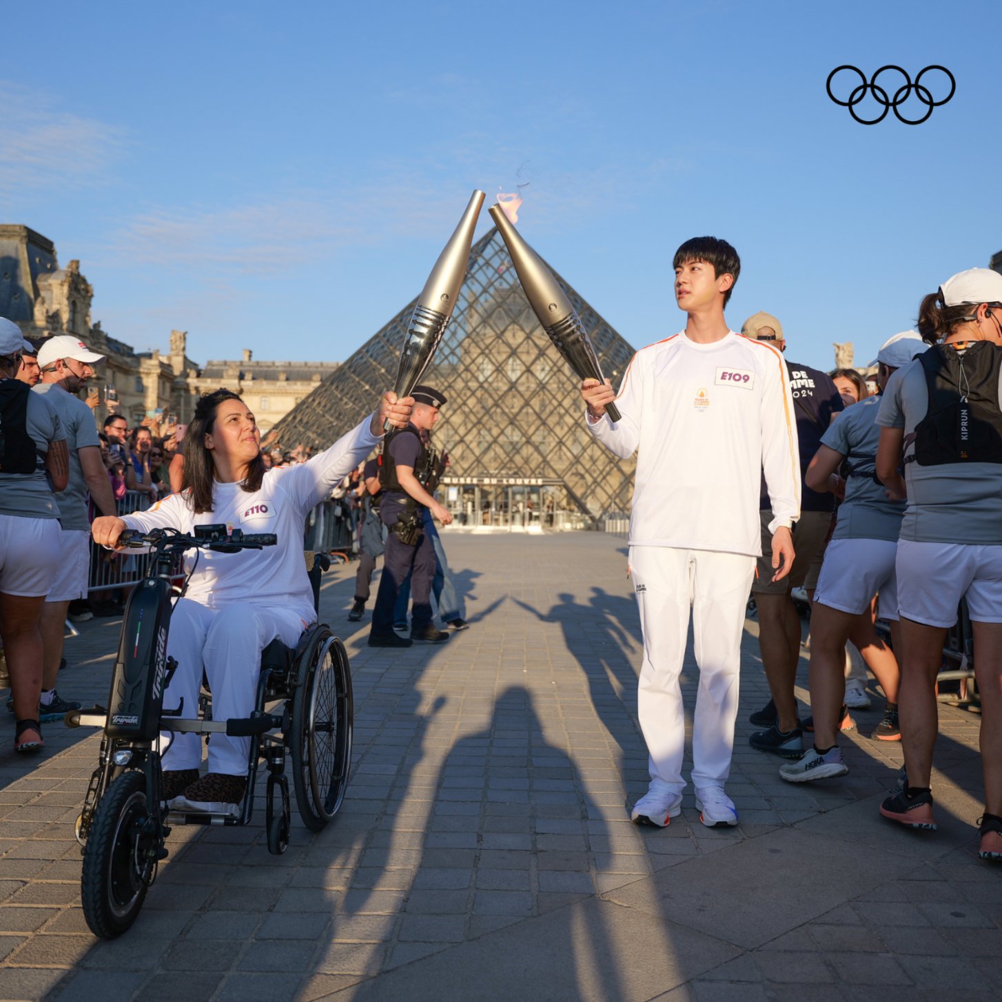 BTS' Jin carries the torch at the Olympic Torch Relay